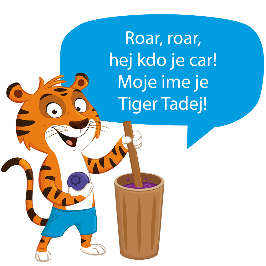 Risani tiger, ki drži žogo in stoji ob vedru.