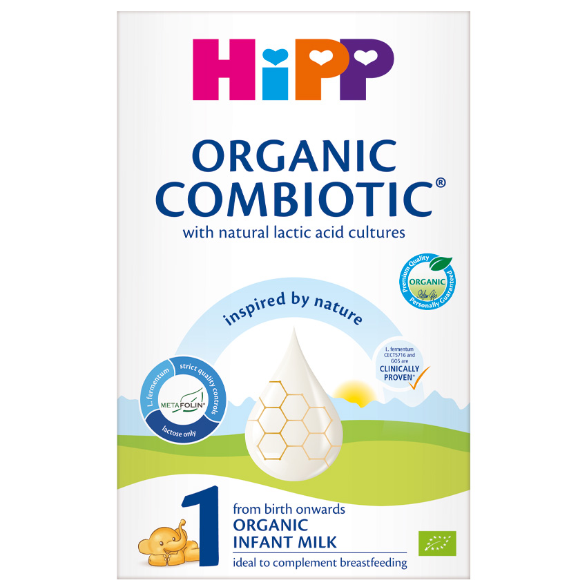 Škatla začetne formule za dojenčke Hipp Organic Combiotic s stilizirano upodobitvijo kapljice mleka, vzorcem satovja in grafiko majhnega medveda.